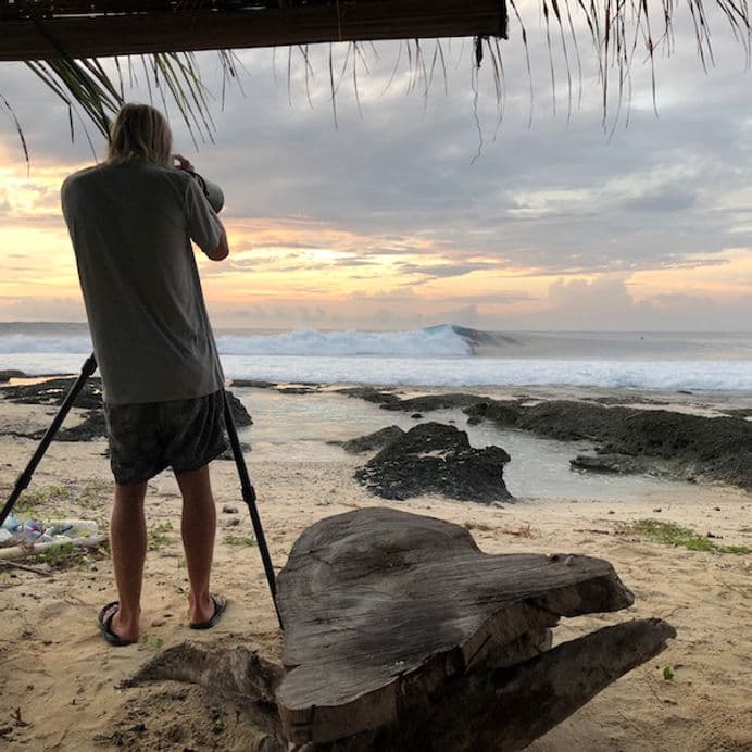Surf photographer watching the Asu wave at sunset