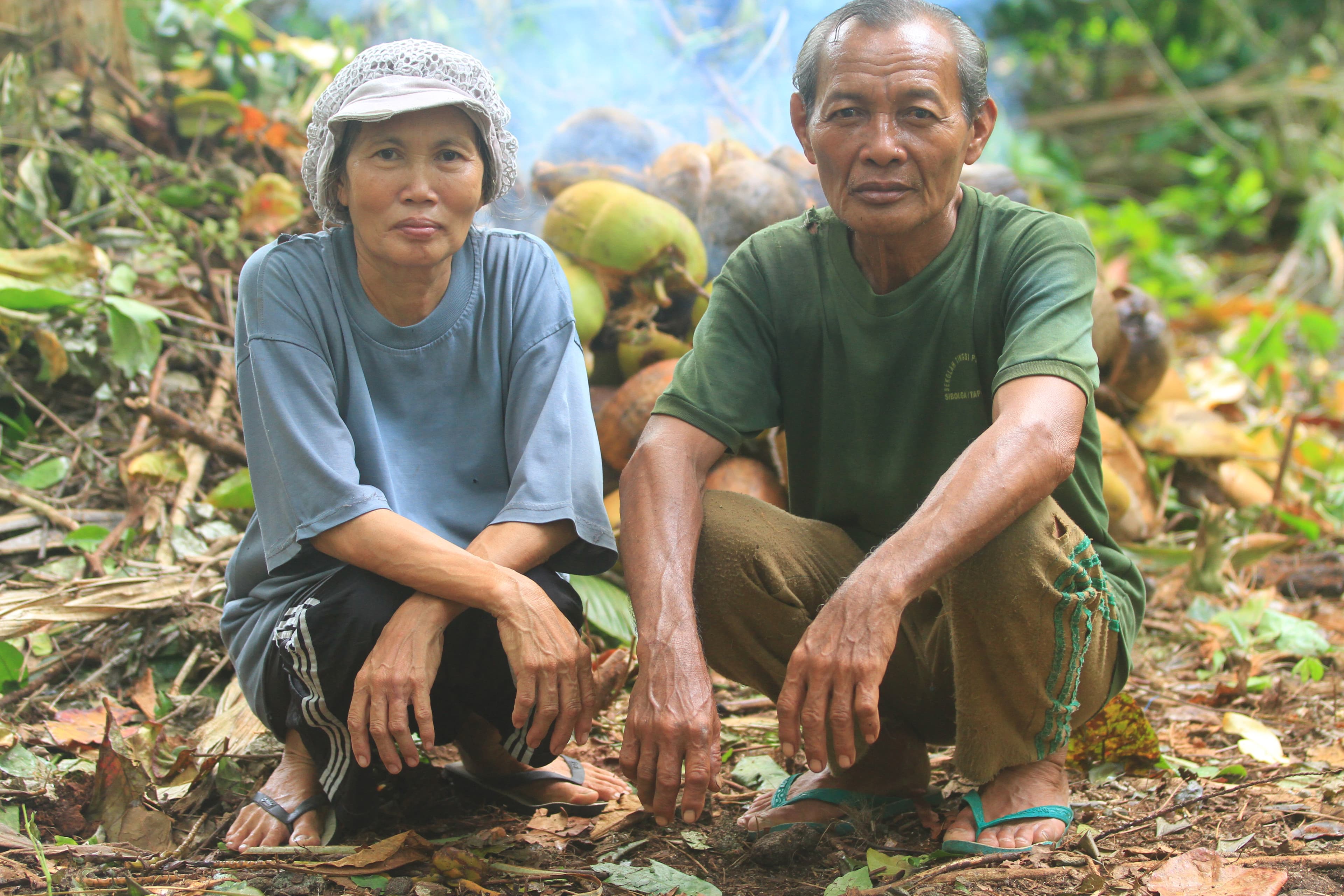 Local couple seated together at Asu Island