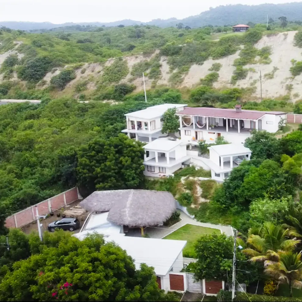 Los Ahorcados from above, the white buildings stepping down the hill to the thatched shala