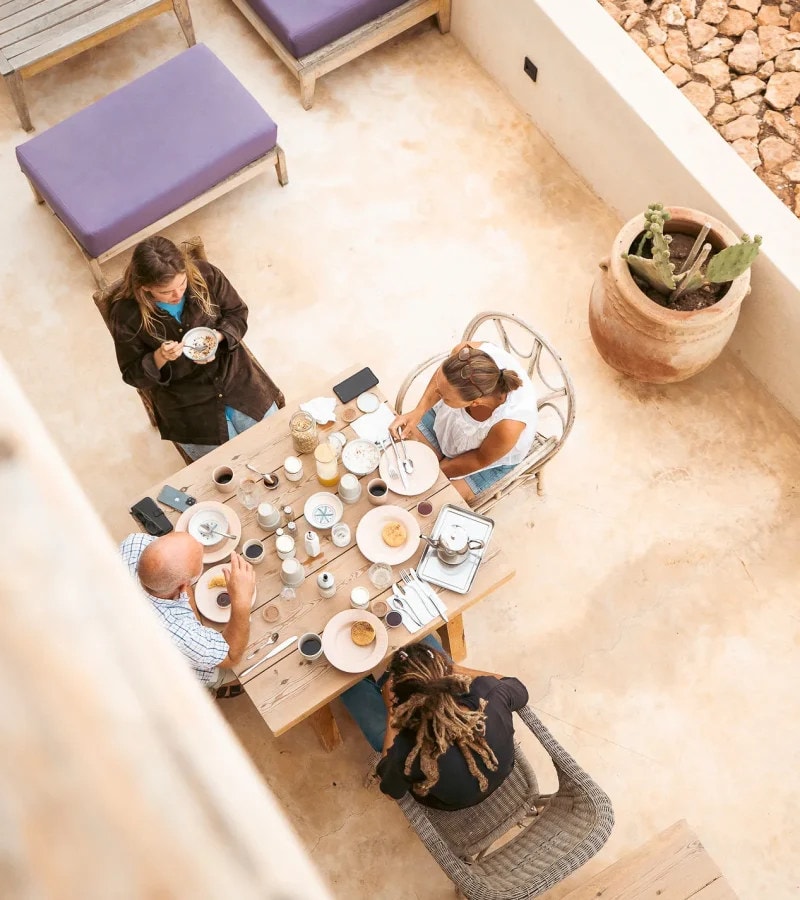 A long table laid for breakfast, seen from above
