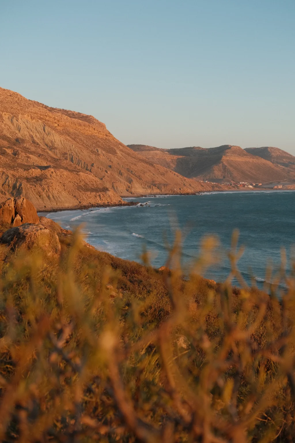 The bay at Imsouane at last light, with the village along the far headland