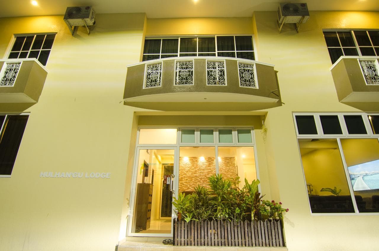 Aria Holiday Maldives guesthouse entrance lit up at night