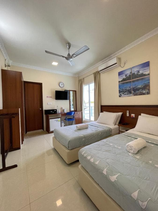 Room with garden view and tropical wall art