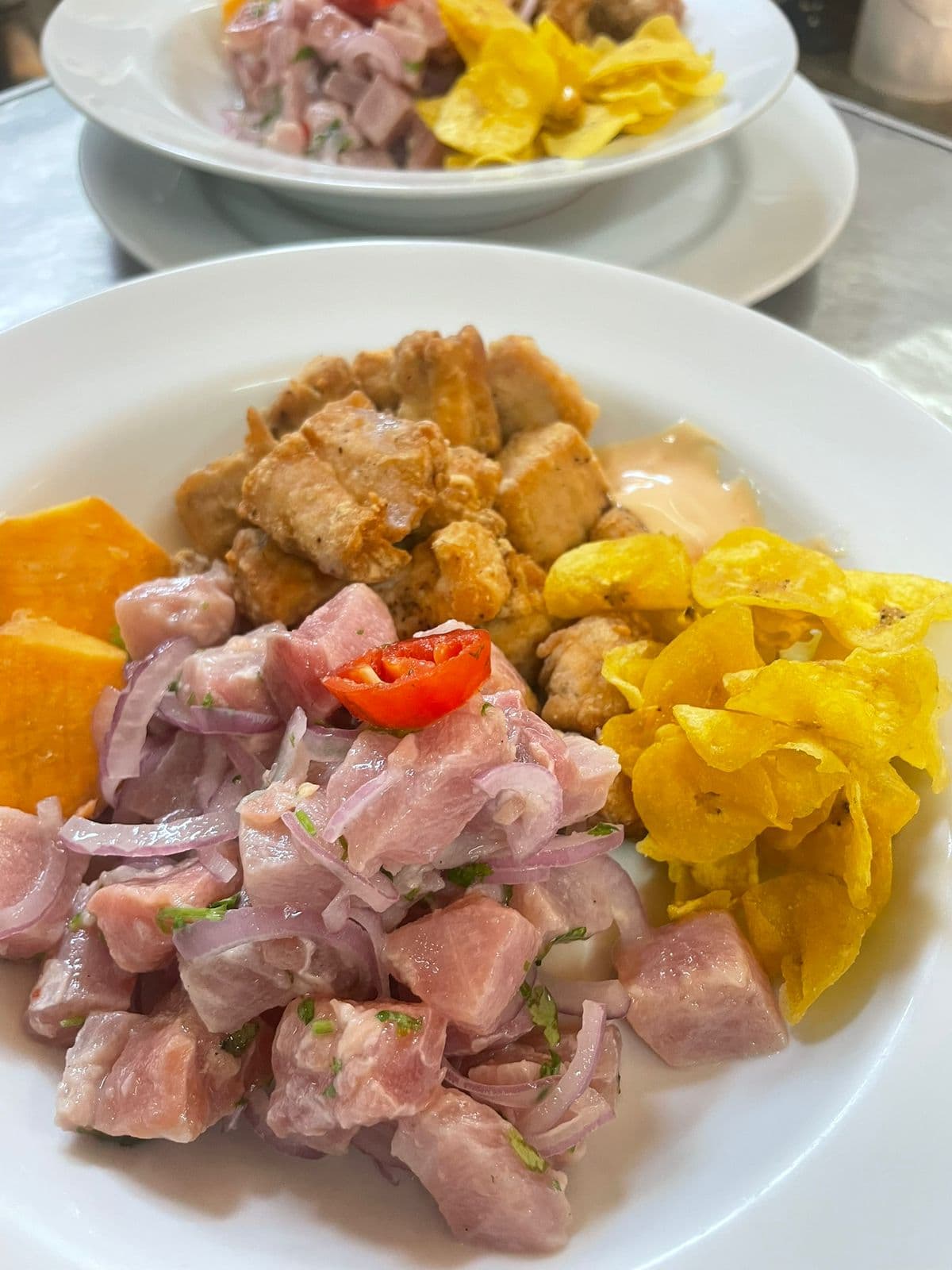 Ceviche and chicharron prepared at El Hueco Villas