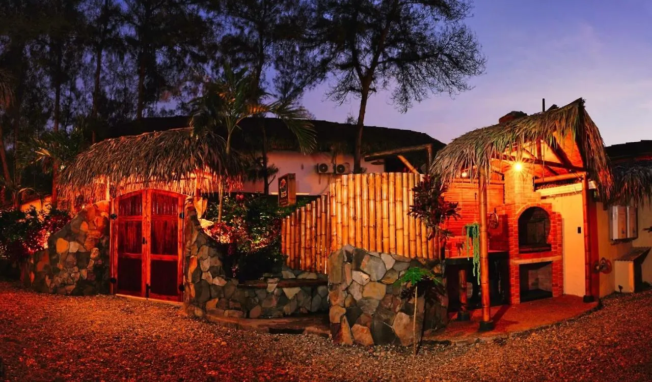 Tres Palmas entrance and brick grill lit up at night